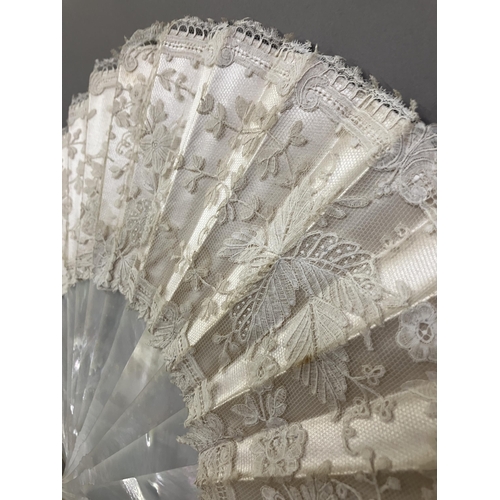 51 - A 19th century Brussels Bobbin Appliqué lace fan, the monture of white mother of pearl, the head sha... 