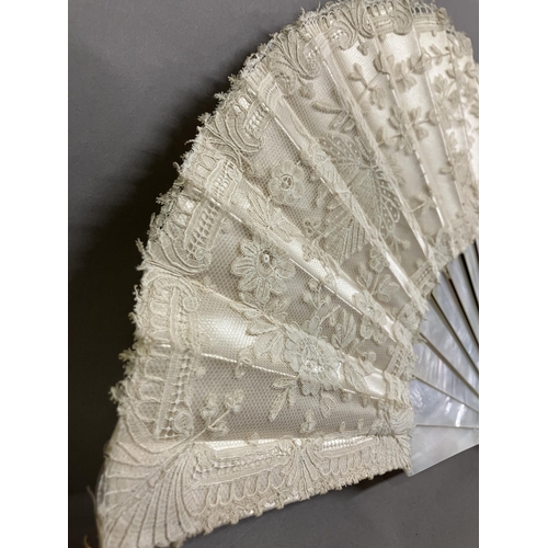 51 - A 19th century Brussels Bobbin Appliqué lace fan, the monture of white mother of pearl, the head sha... 