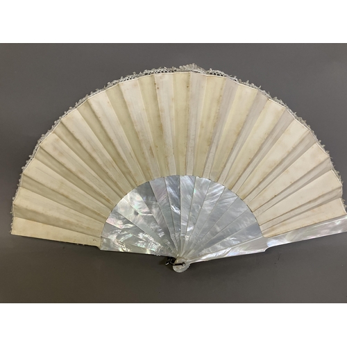 51 - A 19th century Brussels Bobbin Appliqué lace fan, the monture of white mother of pearl, the head sha... 