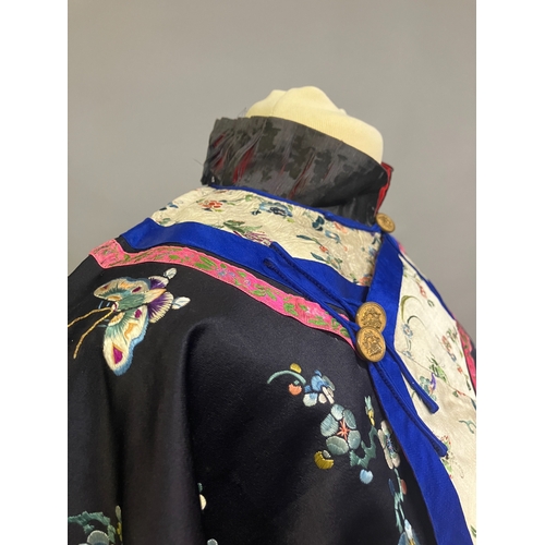 145 - An antique Chinese embroidered silk jacket. Ru, closure to the right, the body of the Ru embroidered... 