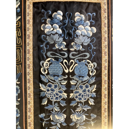 147 - Chinese embroidery: a well-executed embroidered panel, framed and glazed, black silk embroidered in ... 