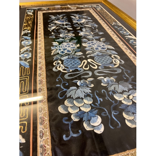 147 - Chinese embroidery: a well-executed embroidered panel, framed and glazed, black silk embroidered in ... 