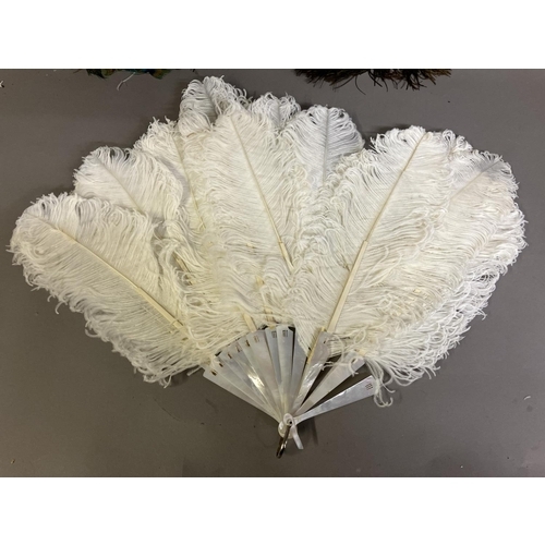 88 - A late 19th century white ostrich feather fan, the monture of white mother of pearl, plain other tha... 