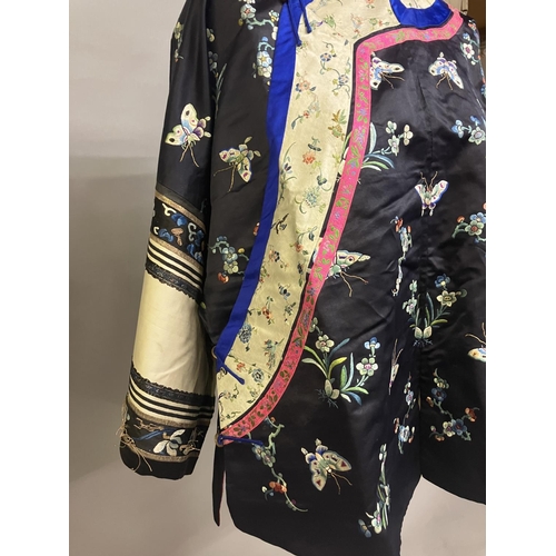 145 - An antique Chinese embroidered silk jacket. Ru, closure to the right, the body of the Ru embroidered... 