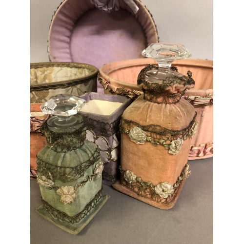 241 - 1920’s French silk and velvet boudoir items and covered glass perfume bottles, still bearing the sho... 