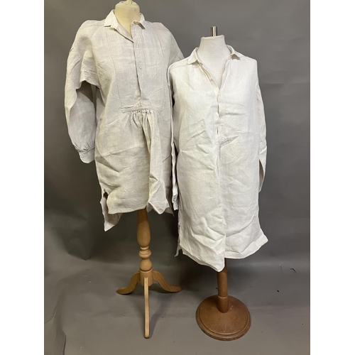 303 - Two mid-19th century rustic gentlemen’s shirts, both heavy linen, from a farming family, with droppe... 