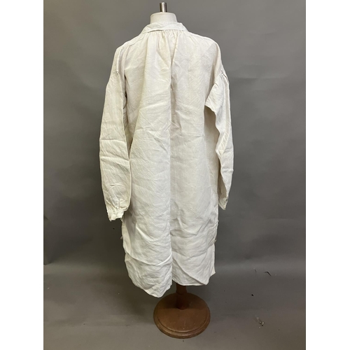 303 - Two mid-19th century rustic gentlemen’s shirts, both heavy linen, from a farming family, with droppe... 