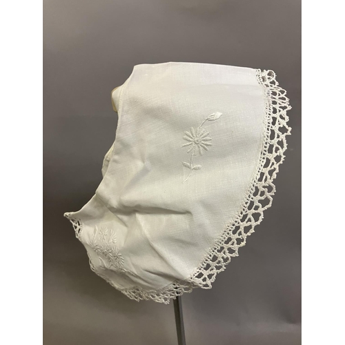 308 - Antique lace: a bonnet veil in cream embroidered net, foliate design; two other hat veils in net, on... 