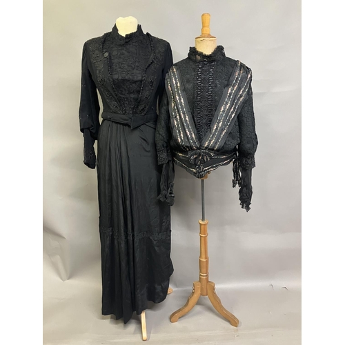 323 - Two Edwardian bodices and a skirt, all in black, none matching, the first bodice in a heavy black cr... 