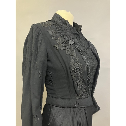 323 - Two Edwardian bodices and a skirt, all in black, none matching, the first bodice in a heavy black cr... 