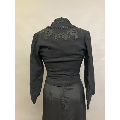 323 - Two Edwardian bodices and a skirt, all in black, none matching, the first bodice in a heavy black cr... 