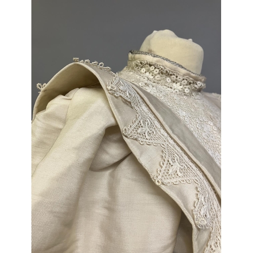 328 - An early 20th century dress for a young girl, cream glazed cotton (?) with chemical lace trimming, h... 