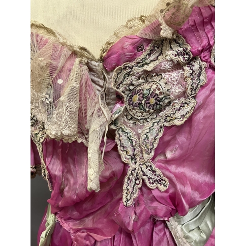 330 - 19th century and Edwardian costume: a late 19th century candy pink silk two piece ensemble, the bodi... 