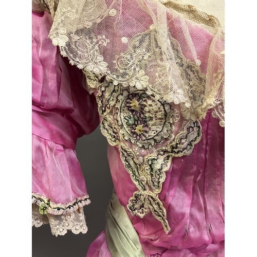 330 - 19th century and Edwardian costume: a late 19th century candy pink silk two piece ensemble, the bodi... 