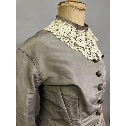 331 - A c 1880’s two piece light grey silk ensemble, the long-line bodice tailored and shaped at the back ... 