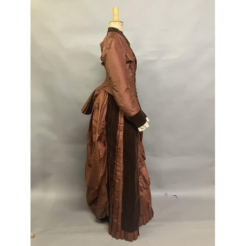 335 - A c 1880’s century two piece costume, mid-brown silk and darker velvet, the bodice with straight sle... 