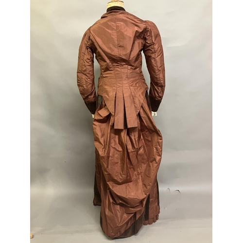 335 - A c 1880’s century two piece costume, mid-brown silk and darker velvet, the bodice with straight sle... 