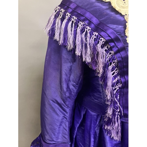 341 - A bold purple silk taffeta two-piece c 1865 -70, the boned bodice with bell sleeves, embossed metal ... 