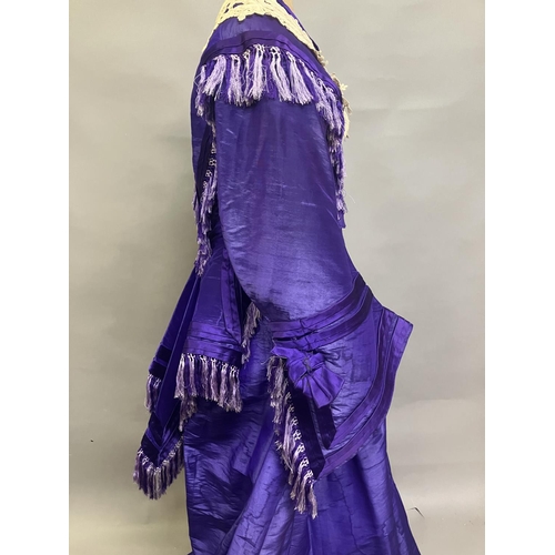 341 - A bold purple silk taffeta two-piece c 1865 -70, the boned bodice with bell sleeves, embossed metal ... 