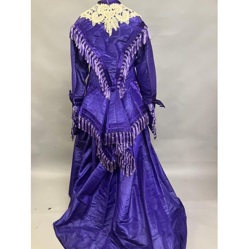 341 - A bold purple silk taffeta two-piece c 1865 -70, the boned bodice with bell sleeves, embossed metal ... 