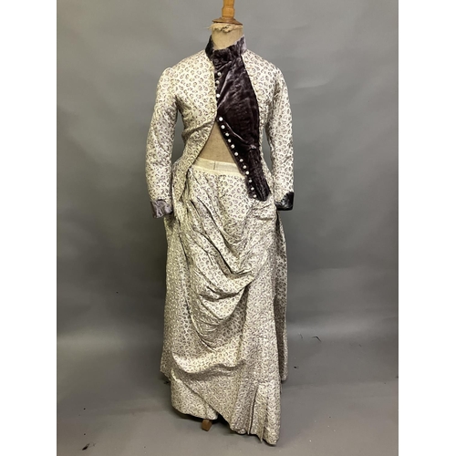 342 - A woven silk bodice and skirt c 1880’s, patterned with small flowers, lilac and cream on cream groun... 