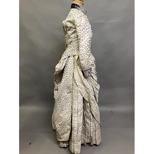 342 - A woven silk bodice and skirt c 1880’s, patterned with small flowers, lilac and cream on cream groun... 