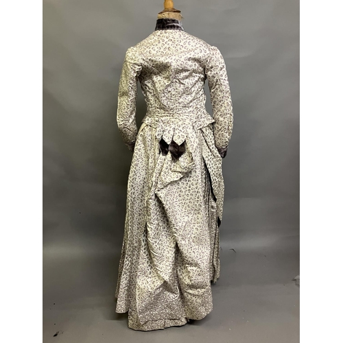 342 - A woven silk bodice and skirt c 1880’s, patterned with small flowers, lilac and cream on cream groun... 