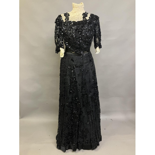 345 - An extravagant sequined and beaded evening ensemble of skirt and bodice, black, the bodice of net wi... 