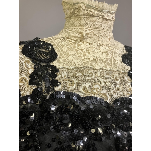 345 - An extravagant sequined and beaded evening ensemble of skirt and bodice, black, the bodice of net wi... 