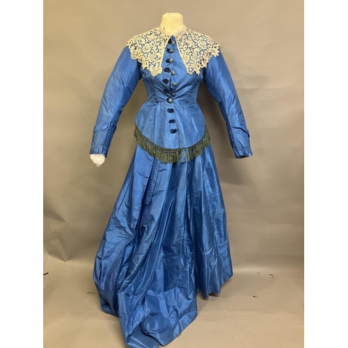 347 - A sky-blue light weight silk two piece ensemble c 1880’s, the tailored long-line bodice with covered... 