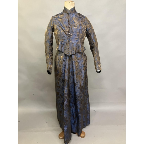 348 - A mid-19th century woven silk two-piece ensemble, dark brown with royal blue flowers and a bronze fo... 