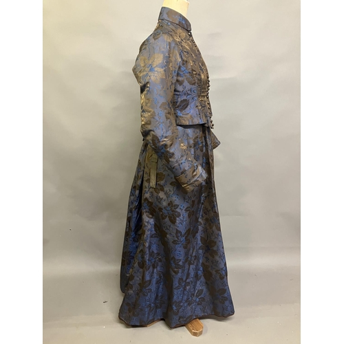 348 - A mid-19th century woven silk two-piece ensemble, dark brown with royal blue flowers and a bronze fo... 