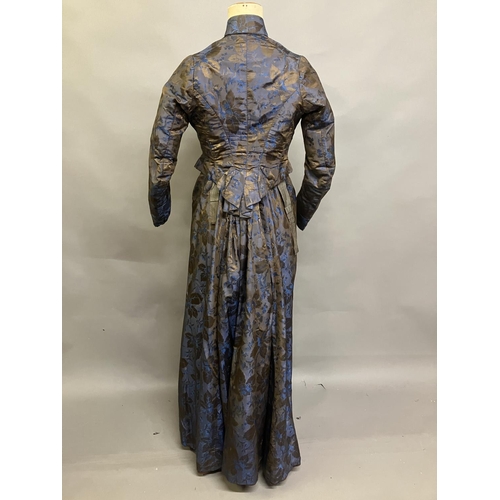 348 - A mid-19th century woven silk two-piece ensemble, dark brown with royal blue flowers and a bronze fo... 