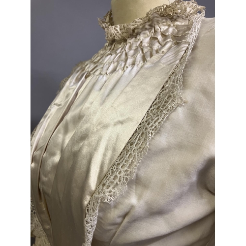 356 - A classic 1880’s wedding two piece, the long -line tailored bodice in fine cream wool with silk sati... 