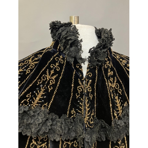 359 - An elaborately beaded Victorian beaded mantle, elbow length, black velvet formed in 2 layers, each t... 