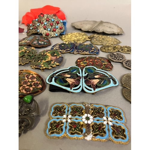 313B - A good selection of 19th and 20th century buckles in metal, others in enamel, others in heavy base m... 