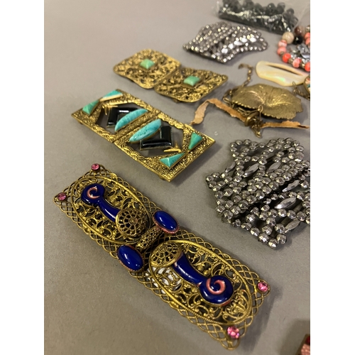 313B - A good selection of 19th and 20th century buckles in metal, others in enamel, others in heavy base m... 