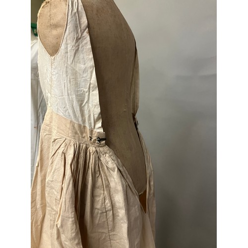 308B - A full-length lady’s undergarment, a long beige linen skirt with a cotton bodice attached, perhaps 1... 