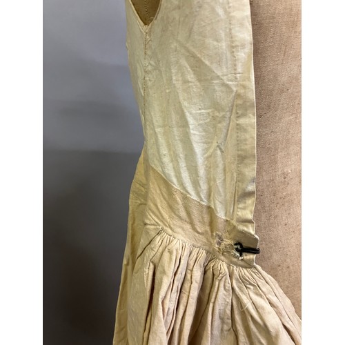 308B - A full-length lady’s undergarment, a long beige linen skirt with a cotton bodice attached, perhaps 1... 