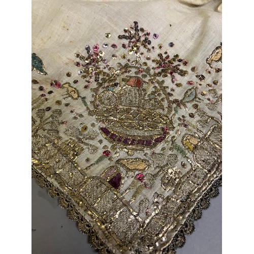 159 - Two 19th century turban covers or wraps, bocha, square, the first of fine linen and very heavily emb... 