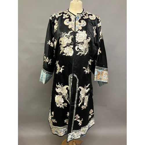 141 - A late 19th c/early 20th century Chinese silk robe, black with applied shaped cloud collar, embroide... 