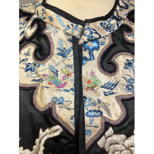 141 - A late 19th c/early 20th century Chinese silk robe, black with applied shaped cloud collar, embroide... 