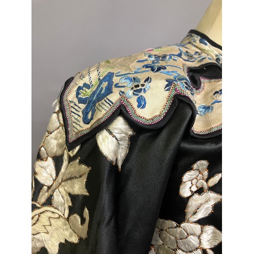 141 - A late 19th c/early 20th century Chinese silk robe, black with applied shaped cloud collar, embroide... 