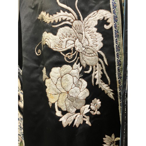 141 - A late 19th c/early 20th century Chinese silk robe, black with applied shaped cloud collar, embroide... 