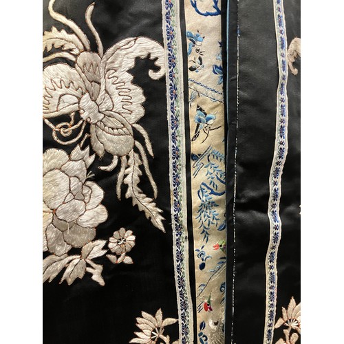 141 - A late 19th c/early 20th century Chinese silk robe, black with applied shaped cloud collar, embroide... 