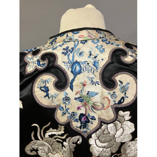 141 - A late 19th c/early 20th century Chinese silk robe, black with applied shaped cloud collar, embroide... 