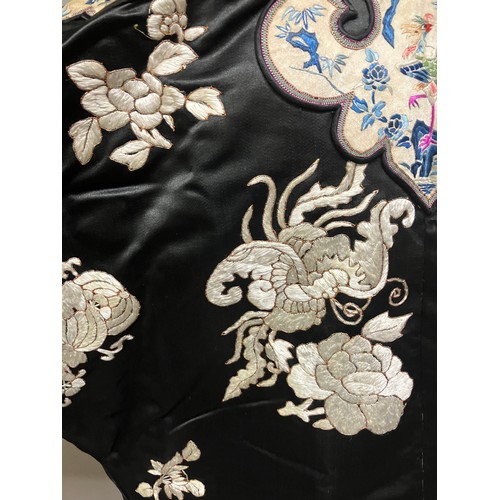 141 - A late 19th c/early 20th century Chinese silk robe, black with applied shaped cloud collar, embroide... 