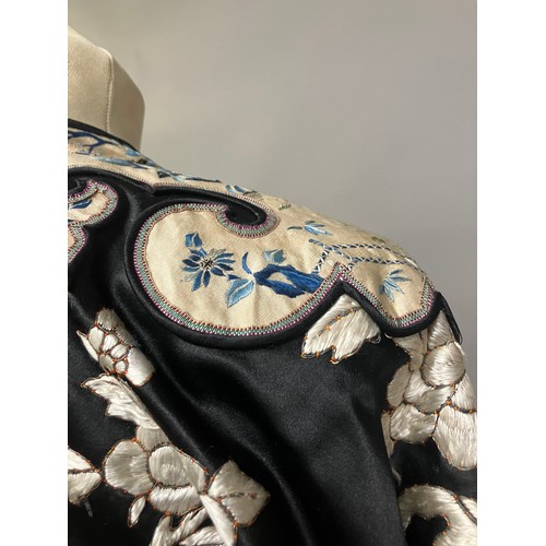 141 - A late 19th c/early 20th century Chinese silk robe, black with applied shaped cloud collar, embroide... 