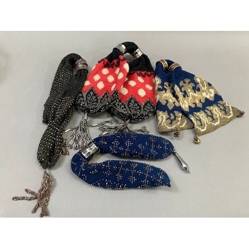 252 - Four large, 19th century miser’s purses, the first crocheted in navy blue with the addition of cream... 