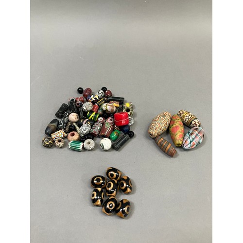 198 - Trade beads: a good quantity of beads, in various colours, shapes and sizes, one segmented, seven al... 